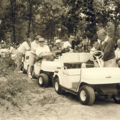 Group of Men on Golf Carts