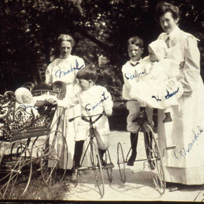 Baby carriages & children with velocipede bicycles