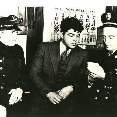 Police with suspect in Mitchell Robbert