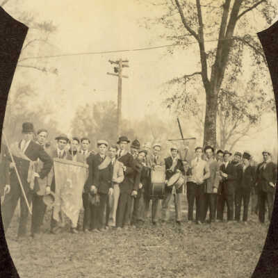 Boys with banners and drums