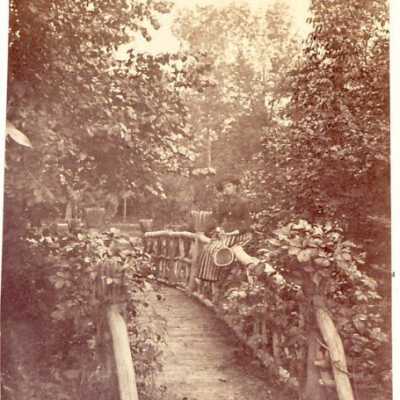 Girl on garden bridge