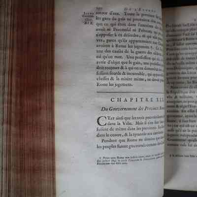 Image of Book XI, Chapter XIX: Shows chapter titled "Of the Government of the Roman Provinces." This image also showcases the red-painted edges of the pages.