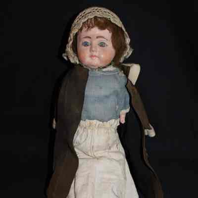 Doll with blue and white dress