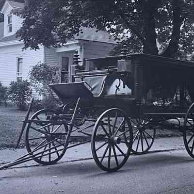 Hearse in front of Moore House