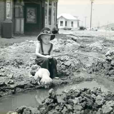 Boy and Dog Fishing on Washington St