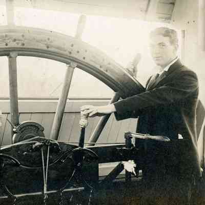 Riverboat Captain at Wheel