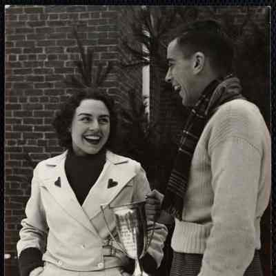 Florence Allen of Burmingham, Alabama Queen of Carnival presenting Joseph Fogarty and the Delta Tau Delta fraternity the cup for the prize winning snow statue.