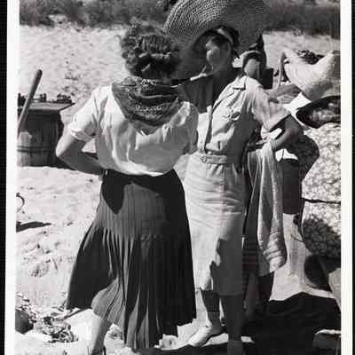 Siasconset clam bake Mrs John Scott + Mrs. Ernest Smith (large hat - smoking)