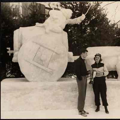 Queen, Dorothy Gerdner presenting Nat Saruple with cup for prize winning sculpture (in background). Dartmouth carnival