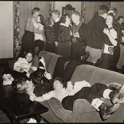 Delta Tau Delta. On the divan L to R: Phoebe Ferris, Smith College; Phil McCoy '40; George Sample '41; Joan Lowry, Vassar