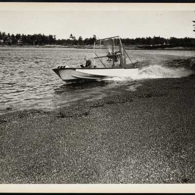 This "boat" raises the cranberries that are caught in the bushes after the bog is flooded - the wind caries the cranberries to shore.