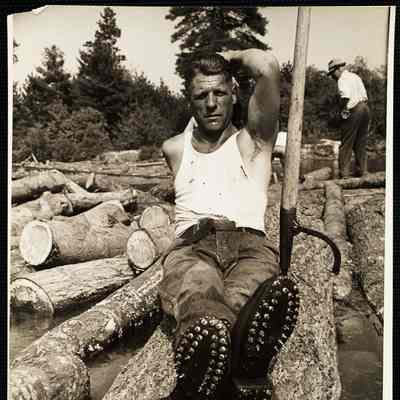 Saco River, man Edward Burrill of Limington, Me. wearing his spiked shoes. 1939