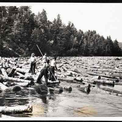 Wide World Photos Boston Bureau Logs go down the oldest drive in the United States. Biddeford, Maine - Log drivers wearing spike shoes and working with pick poles free the huge pine logs that jam at the trip boom in Hiram, Maine, on the Saco Rover. (note - see main caption)