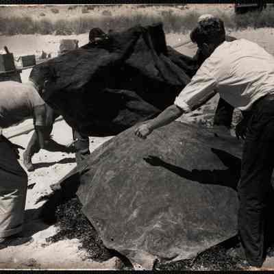 Nantucket clam bake. After covering everything with more sea weed the whole pile is covered with canvas.