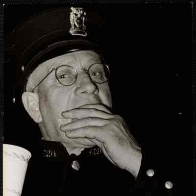 Former chief of police H.A. Coolbeth - now of Vermont - came down for party + friends made him put on uniform.
