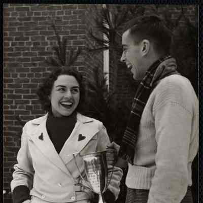 Florence Allen of Burmingham, Alabama Queen of Carnival presenting Joseph Fogarty and the Delta Tau Delta fraternity the cup for the prize winning snow statue.