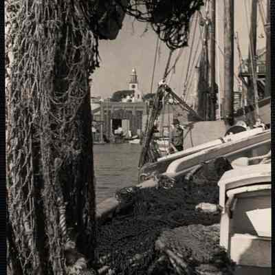 Nantucket. South tower thru nets of fishing boats here at Old South Wharf.