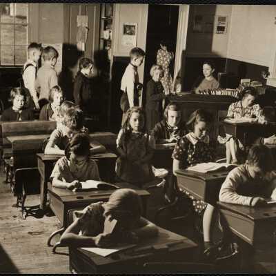 Children Crusade - Bennington, VT. Mt. Pleasant School in Sunderland - children putting pennies in cans on teacher DUNDON's desk.