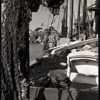Nantucket. South tower thru nets of fishing boats here at Old South Wharf.