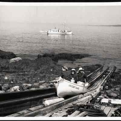 Matinicus Rock, Maine. Visitors (bird lovers) being hauled up the ramp by the Coast Guard