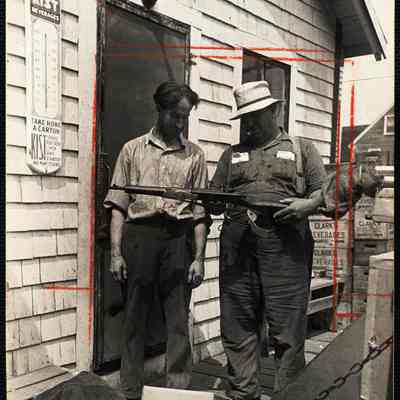 Hanna shows assistant(?) new rifle he is delivering to one of his customers. (At Bristol Mills)