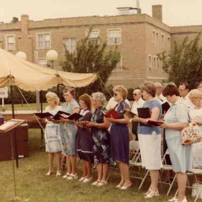 Chancel Choir singing at the Outdoor Service on July 18, 1982.