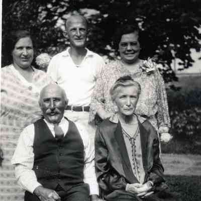 James and Annie Martin sitting in front. Ellen Martin is on very right in back row.