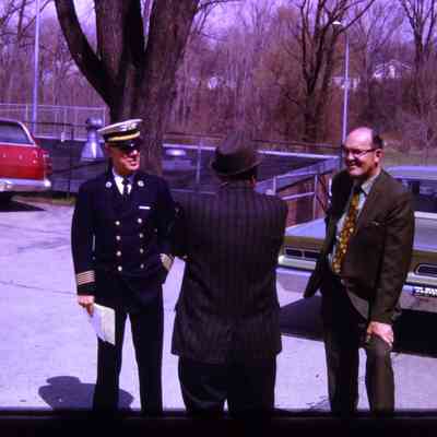 City officials talking in parking lot