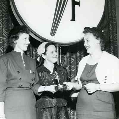 Mrs. Donald (Ruby) Culp- Wayne Residential Chairman, Mrs. Victor Marsh- United Foundation Women's Organization Chairman, Mrs. Richard McLaughlin- recieving an "Oscar" for attaining 145% of quota