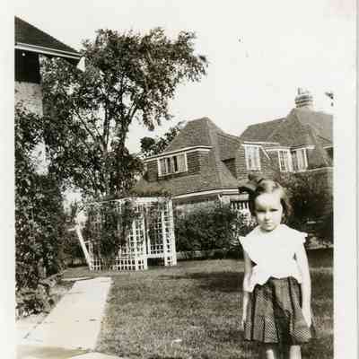 Bernice Greenwalt with house at 3240 Elizabeth St. in Wayne, MI in Background.