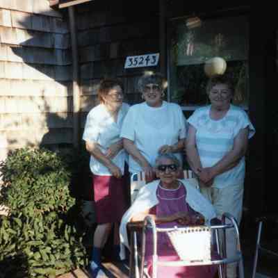 Betty Brown, Betty Marrow and Jean Chambers are standing with Elsie Raymo in front on July 8, 1991.