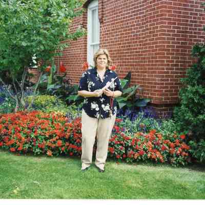 Linda Bailey in 1997 standing outside of the Museum.