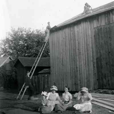 Roof repair of a barn.