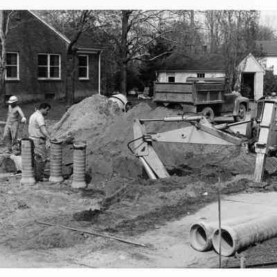 D.P.W workers working on a sewer line.