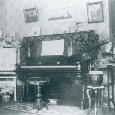 Interior Scene, Barnard Chubb House Parlor, Large picture on stand is Lucius Barnard (b. 1874), who died after diving into water in Massachusetts in 1896. Myra and Lenas Brother.