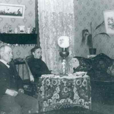 Henry and Olive Barnard in their parlor.