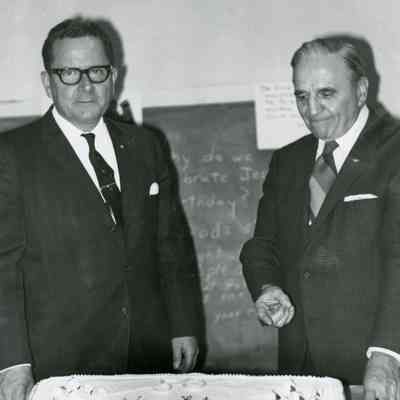 Wayne Rotary Members Cutting the Cake