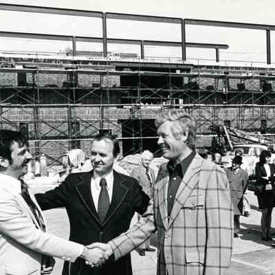 Building under construction. Man in middle is Pat Norton, Wayne Mayor