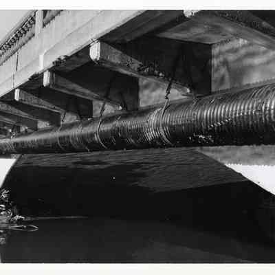 Pipe Underneath a Bridge