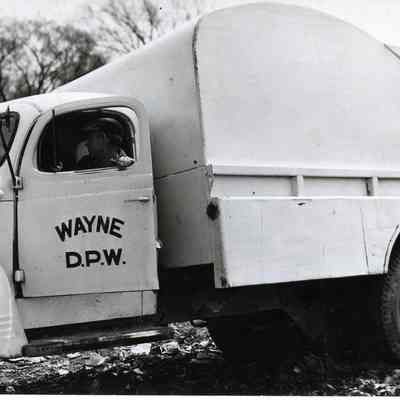 D.P.W Dumping Trash in Landfill