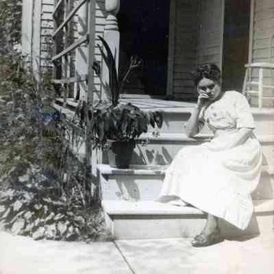 Ellen Martin sitting at her house.