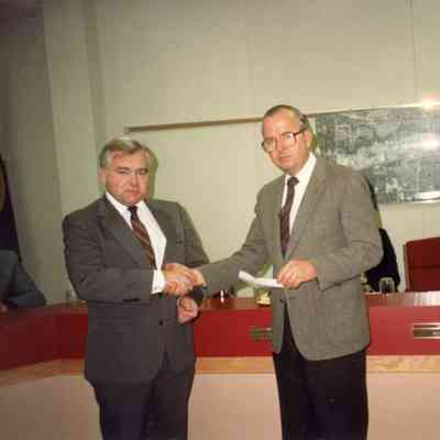 John Dawson of Lions Club presenting check to Pat Norton to purchase a telephone device for the deaf on Nov. 17,1988.