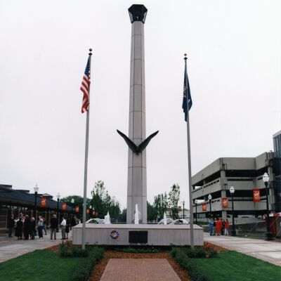 Peace Memorial looking East from Wayne Road, Veteran's Plaza (Main Street) with library and parking structure in background.
