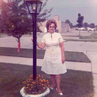 Eileen Lekas on Gloria St. with the Taft School behind her.