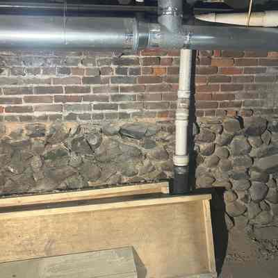 Fieldstone foundation in basement