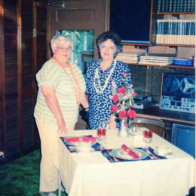 Doris Carpenter and Sharon Arthur by a table display.