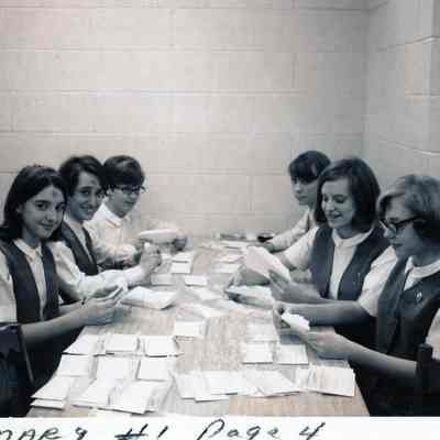 Women checking envelopes