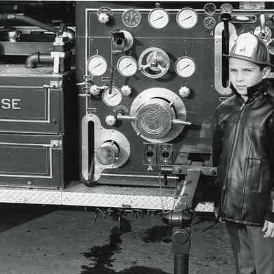 Boy next to Fire Truck