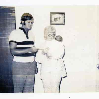 Fr. Beuhner presenting bond to Mrs. Joseph Vance for 6 week old son Andrew