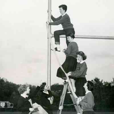 Faye Perry, Anita Swartz, Shirley Hickey, Alice Neddrie, Pat Millar, Pattie Bingel (NOV 1954 - decorating the goalposts.
